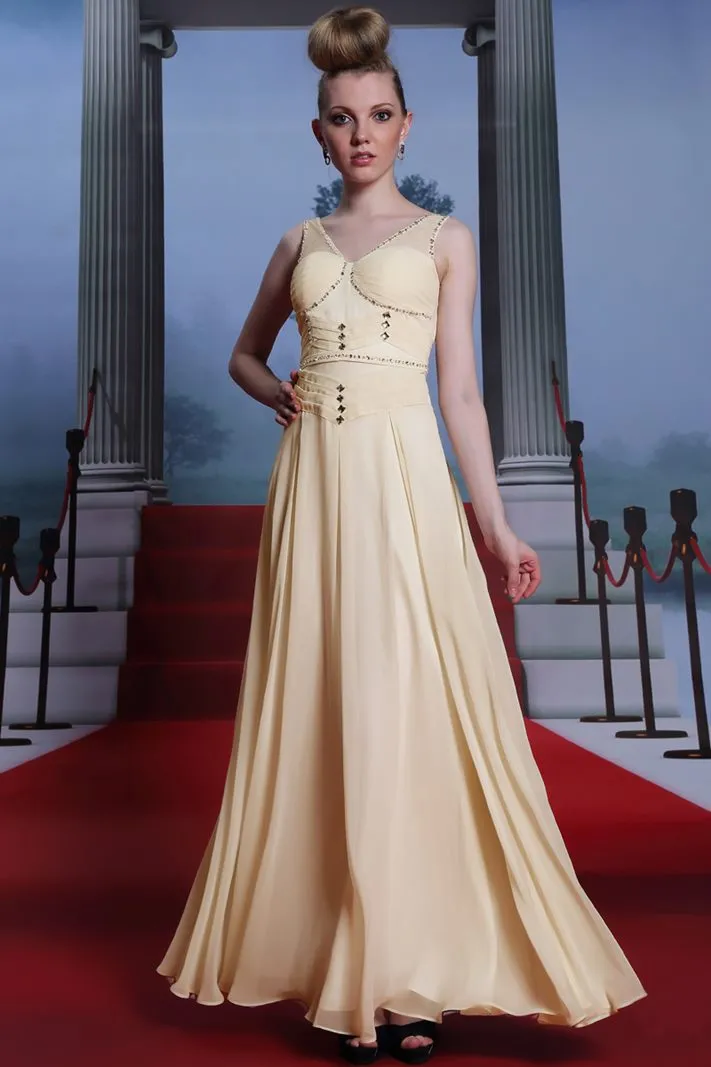 ---Light yellow ceremony dress made in chiffon with draped bodice and many decorations of sparkling stones--