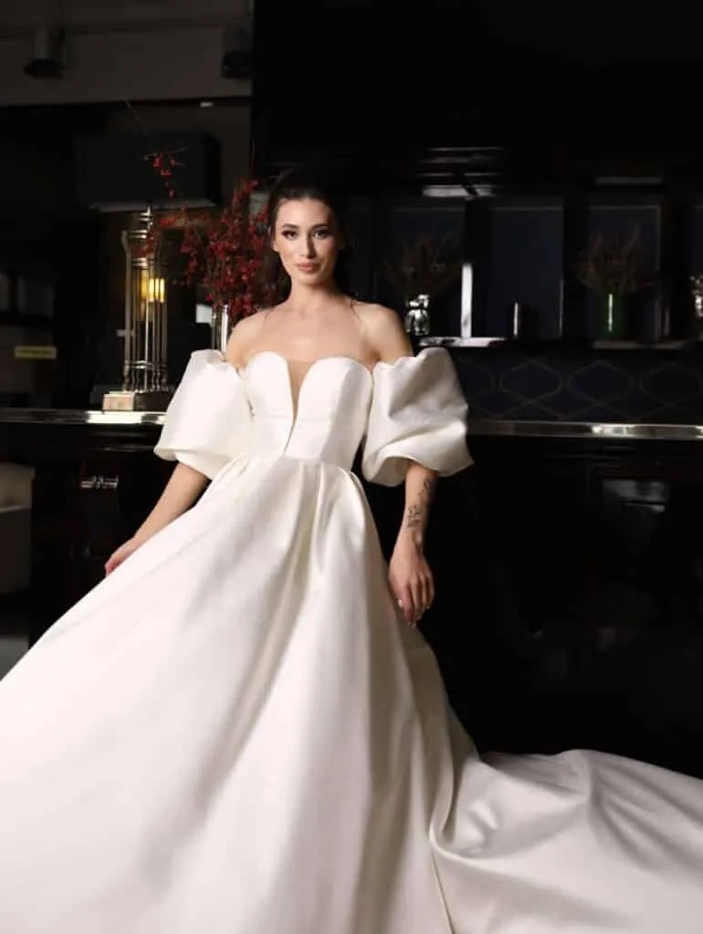 ---Long satin dress with puffed sleeves, deep V-neckline, this is how the new 2022 bridal collection is presented--