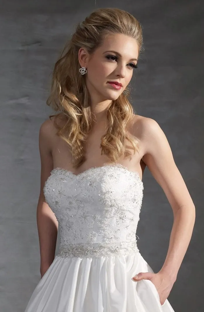 ---Tailored asymmetrical wedding dress short on the front and with train on the back, princess style with tone-on-tone lace appl